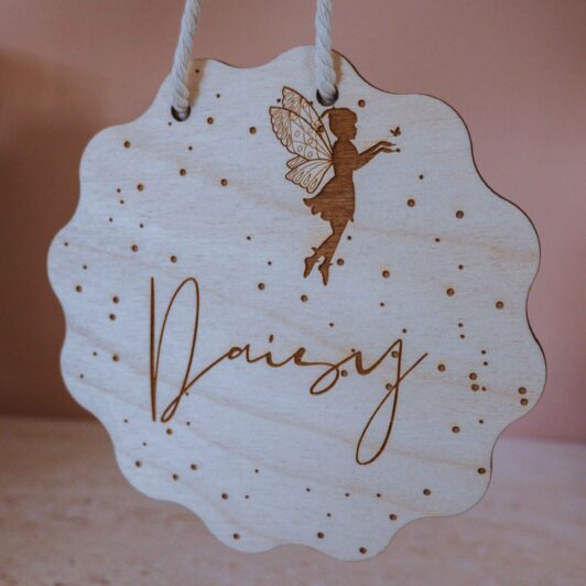 Hanging timber door name sign with fairy