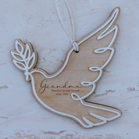 Timber dove engraved with name and white outline